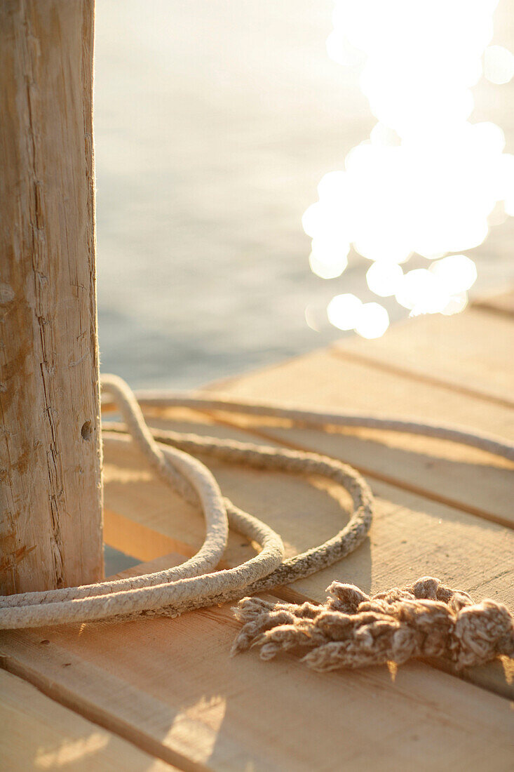 Ropes on a wooden jetty, Santa Giulia beach, South Corsica, France