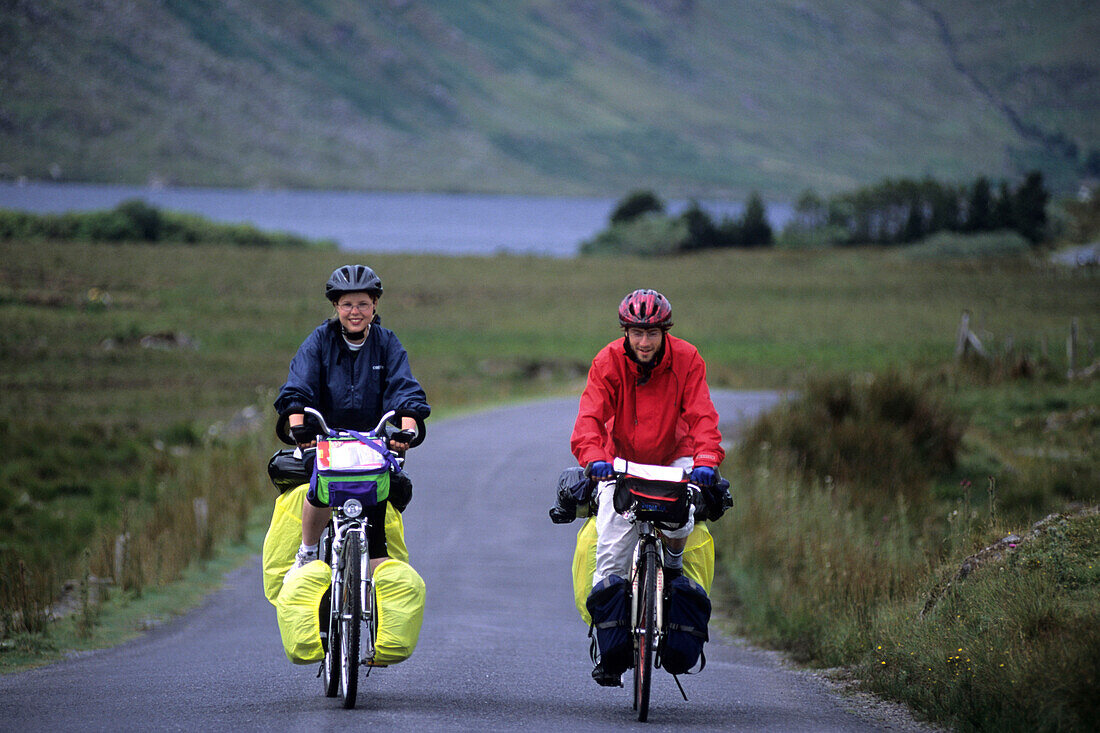 Cyclists on Connemara Road, Near Lough Fee, County Galway, Ireland