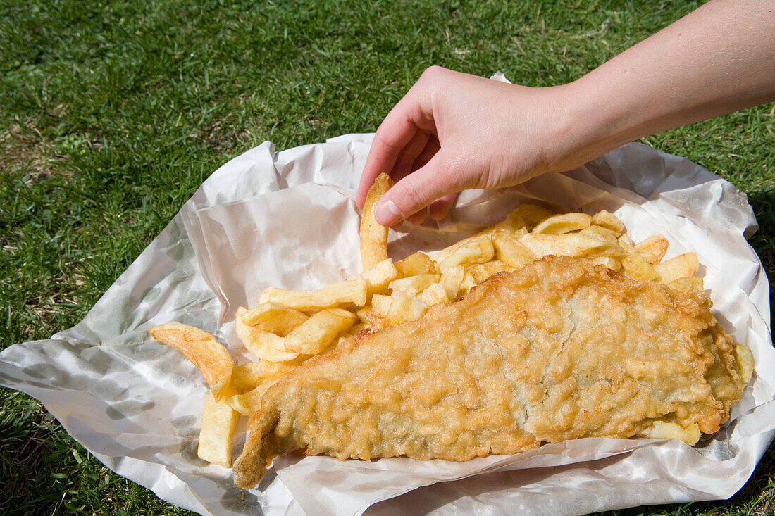 Enjoying Fish & Chips on Lawn, From Leo Burdock Fish & Chips Shop, Dublin, Ireland