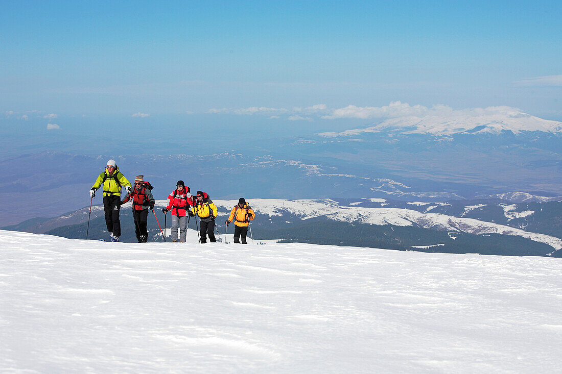 A group of people on a ski tour to the top of Popova Kapa in the Rila Mountains, Europe, Bulgaria, MR