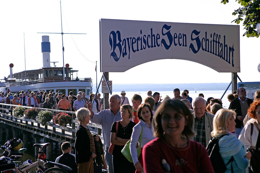 Passengers leaving Ammersee steamboat, Herrsching, Ammersee, Bavaria, Germany