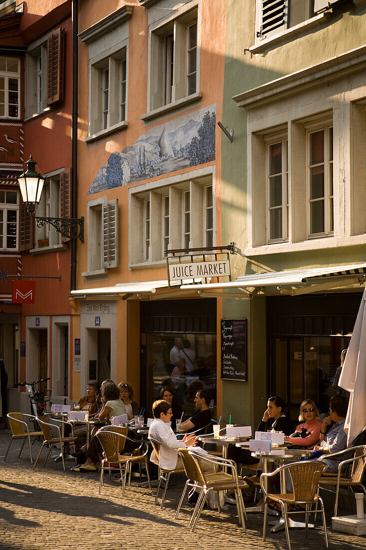 People sitting in a small pavement cafe, Augustinergasse, Zurich, Canton Zurich, Switzerland