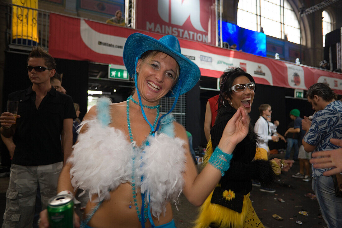 Raver, dressed in blue, dancing during an opening in the station, Street Parade (the most attended technoparade in Europe), Zurich, Canton Zurich, Switzerland