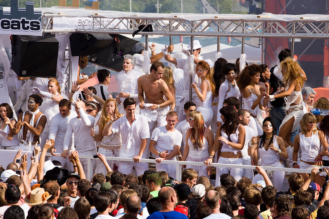 Group of young ravers dressed up in white clothes dancing on a Love Mobile near Quai Bridge, Street Parade (the most attended technoparade in Europe), Zurich, Canton Zurich, Switzerland