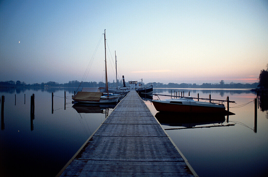 Boats tied to jetty, Geltow Mecklenburg-Western Pomerania, Germany