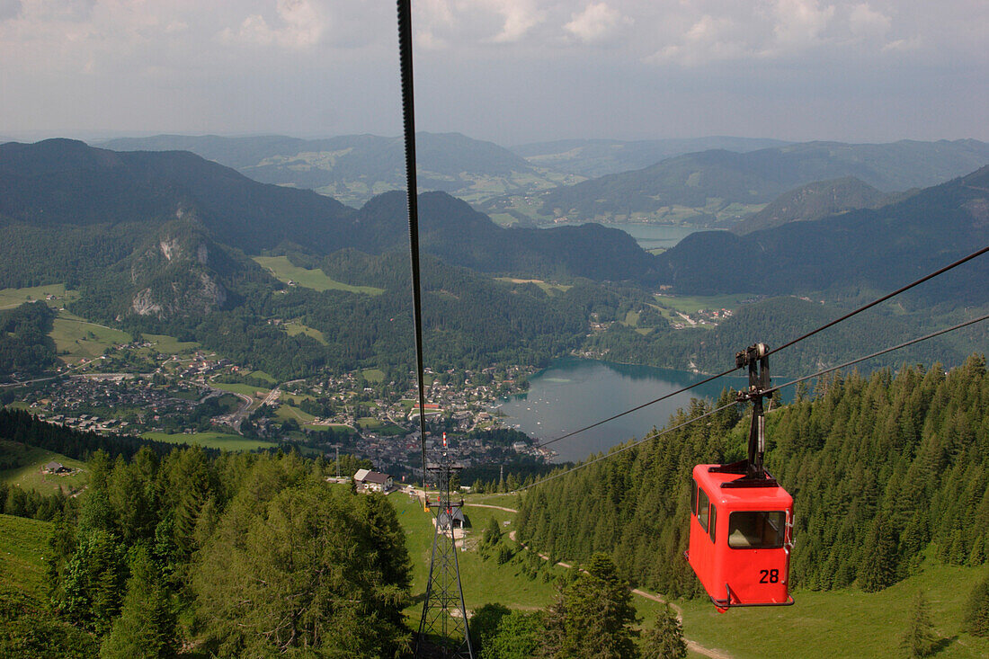 View from the Zwoelferhorn over lake Wolfgangsee with cable car, Salzburg, Austria