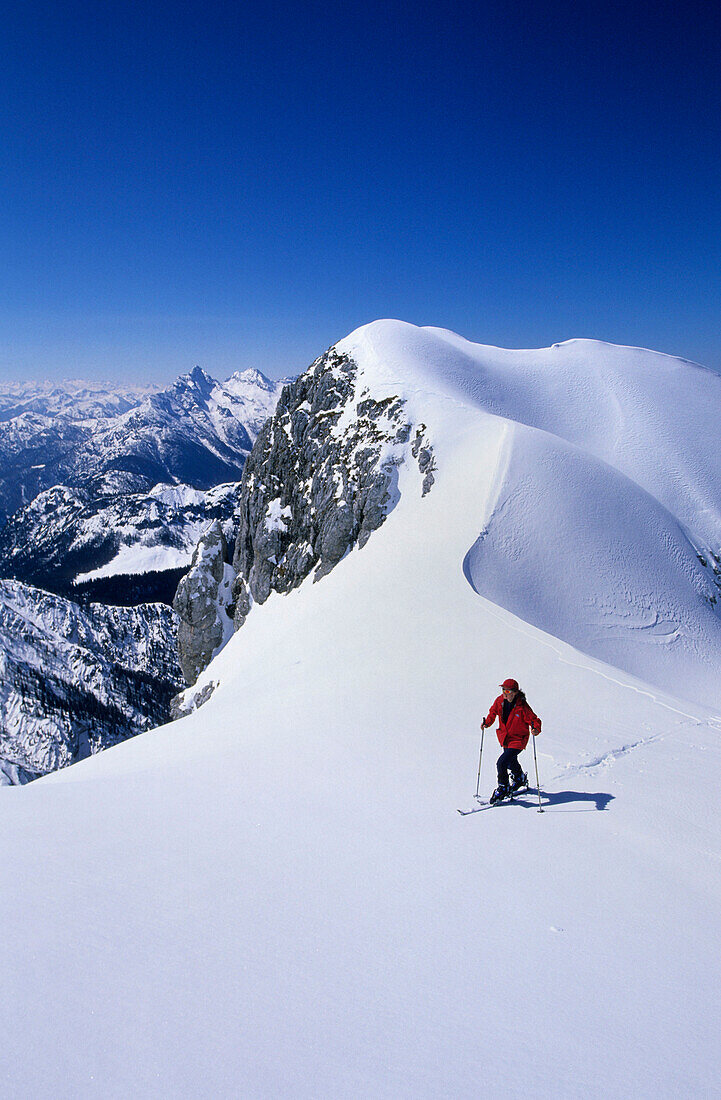 Backcountry skier at summit ridge, ascend to Wagendrischlhorn, Reiteralm range, Berchtesgaden, Upper Bavaria, Bavaria, Germany