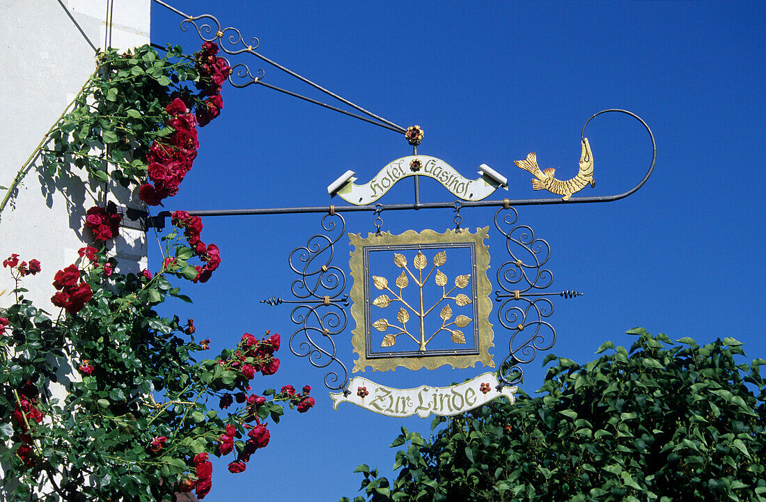 Wrought-iron sign for restaurant Zur Linde, Fraueninsel Island, Lake Chiemsee, Chiemgau, Upper Bavaria, Bavaria, Germany