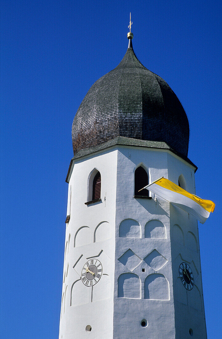 Clock tower of nunnery decorated with flag, island of Fraueninsel, Lake Chiemsee, Chiemgau, Upper Bavaria, Bavaria, Germany