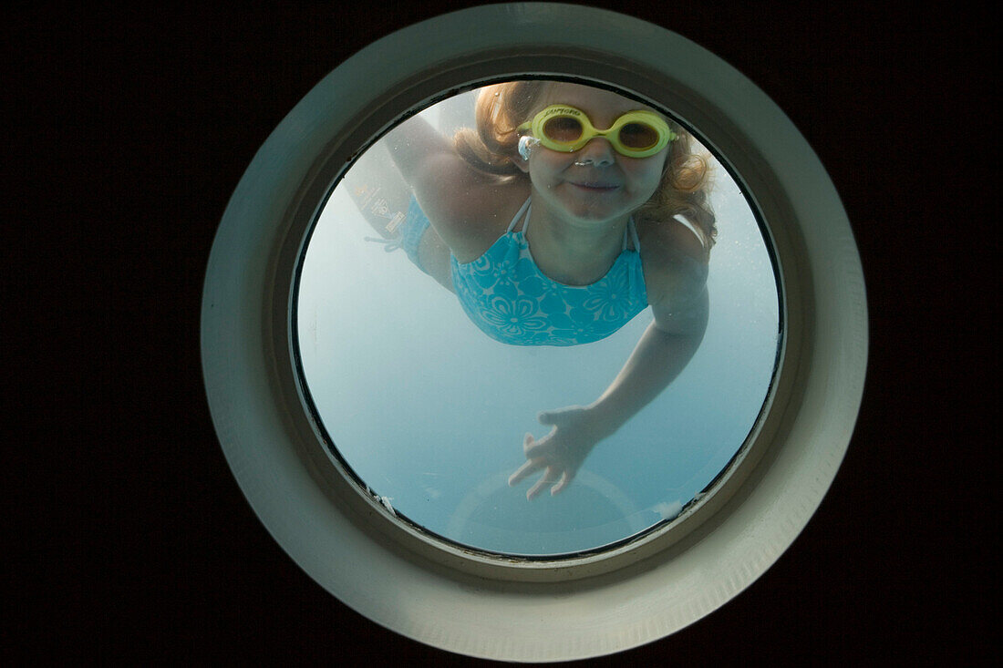 Girl Looking Through Swimming Pool Porthole, Aboard Star Clippers Star Flyer Sailing Ship, Aegean Sea