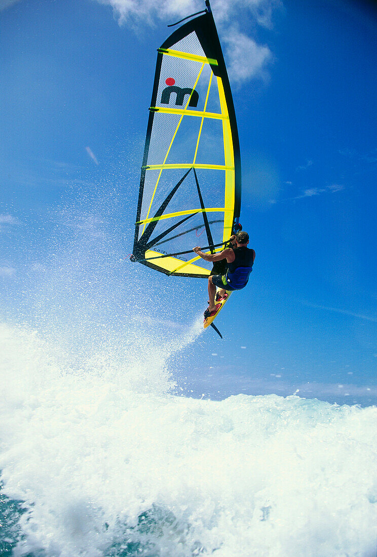 A windsurfer windsurfing near Hawaii, USA, America