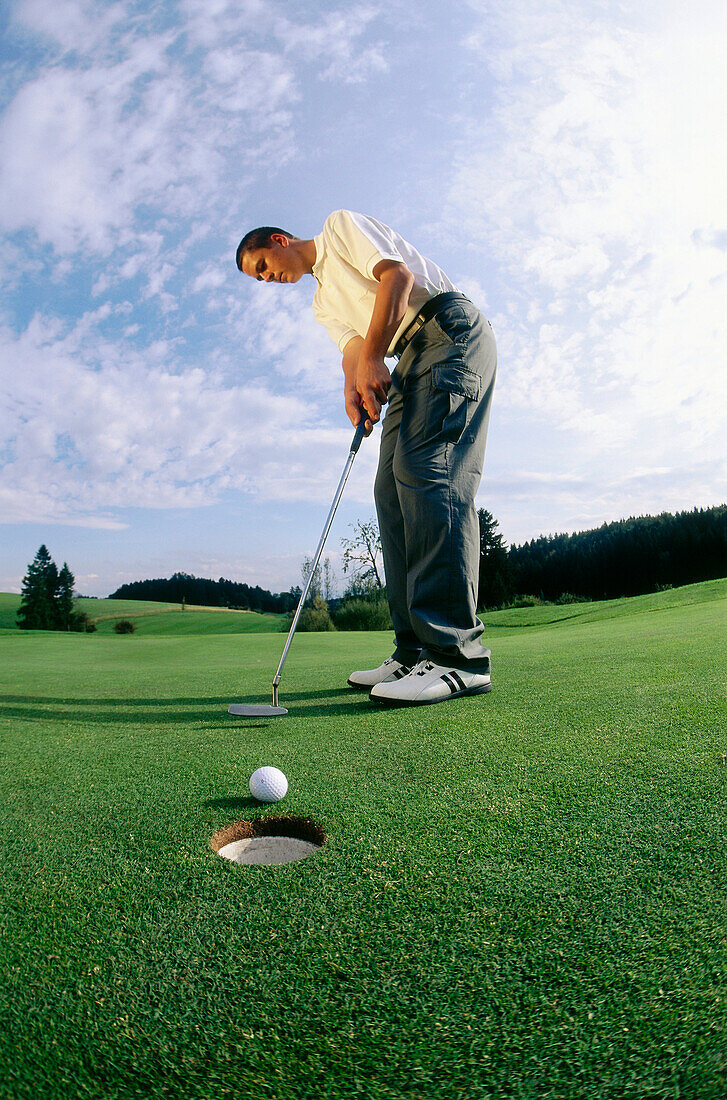 Man playing golf, Paehl, Bavaria, Germany