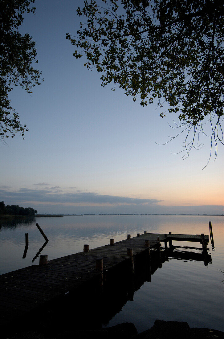 Wooden pier at Peenestrom at sunset, Isle of Usedom, Mecklenburg-Pomerania, Germany, Europe