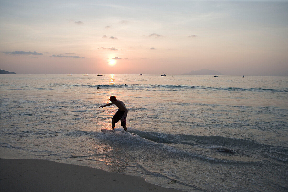 Skimboarder at Beau Vallon Bay,Beau Vallon, Mahe Island, Seychelles