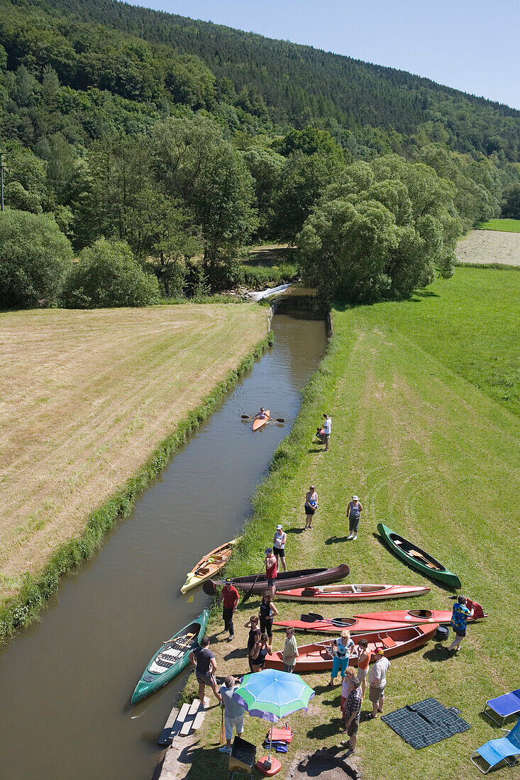 Preparing for Canoe Excursion on River Haune,Haunetal-Rhina, Rhoen, Hesse, Germany