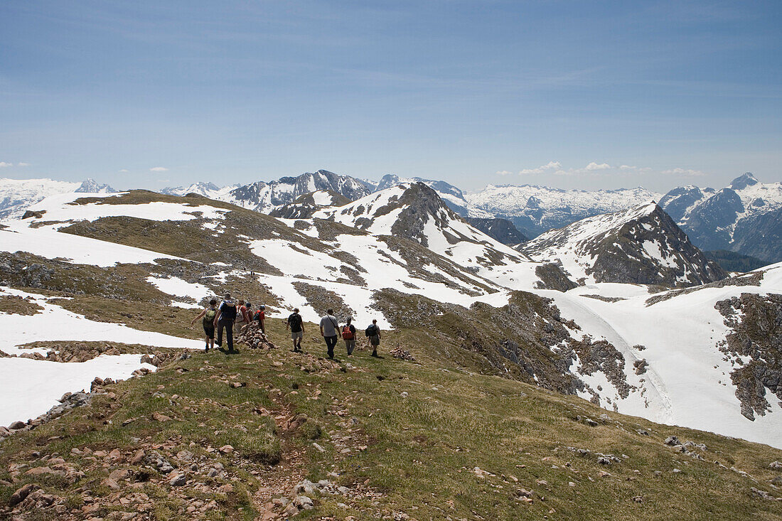 A group of hikers descending from Schneibstein Mountain, Near Berchtesgaden, Berchtesgadener Land, Bavaria, Germany