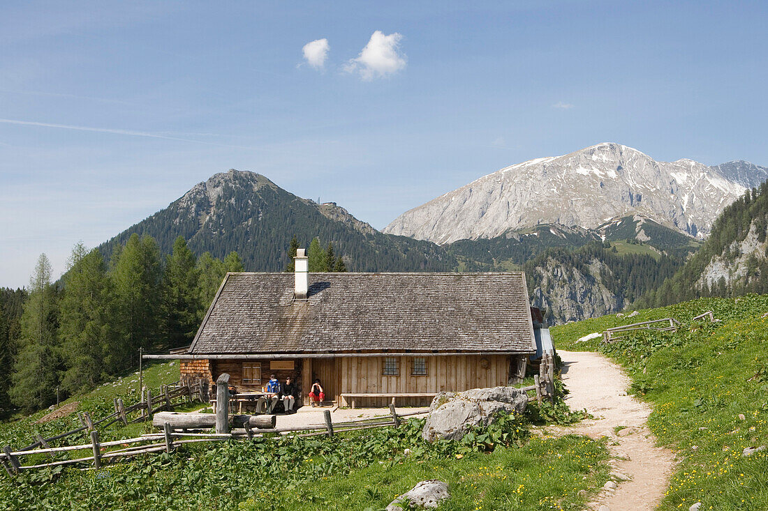 Hikers resting at a mountain hut near Jenner Mountain, Lake Koenigssee, Berchtesgaden, Berchtesgadener Land, Bavaria, Germany