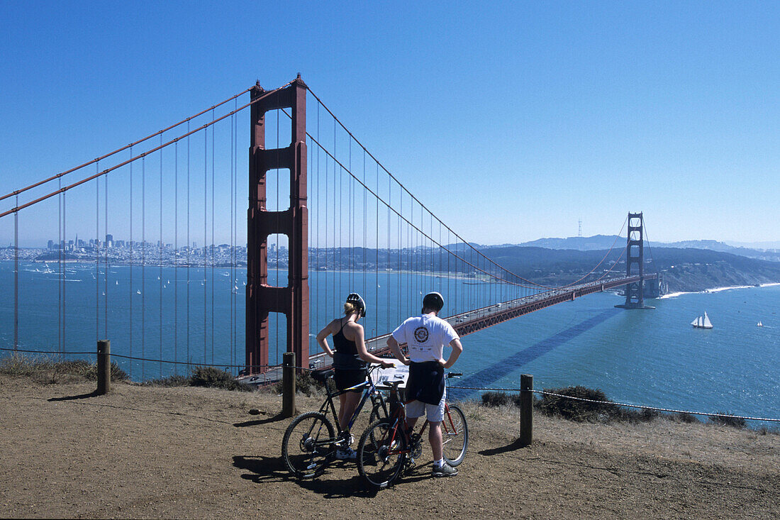 Cyclists Overlooking Golden Gate Bridge & San Francisco Bay,San Francisco, California, USA