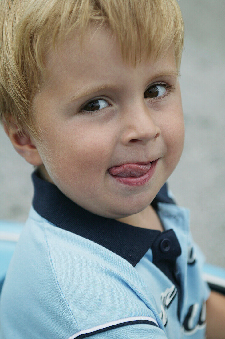 Boy sticking out tongue, close-up