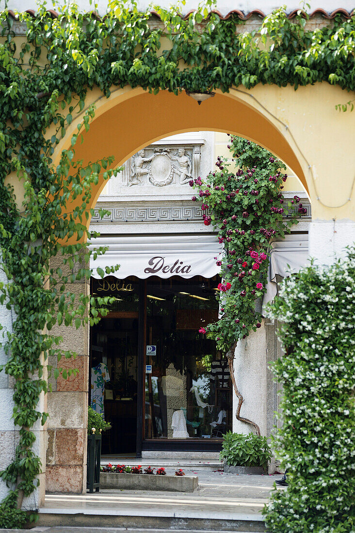 View through a gateway to a shop, Gardone, Lago di Garda, Italia