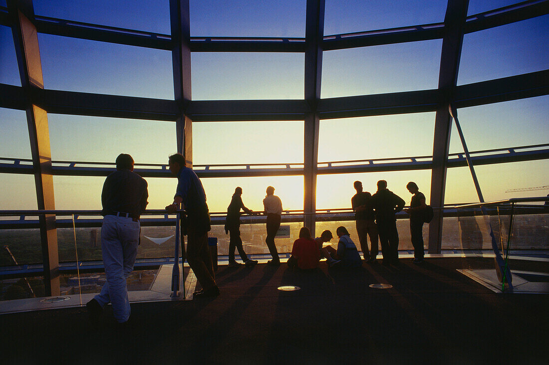 Tourists visiting glass dome, Reichstag building, Berlin, Germany