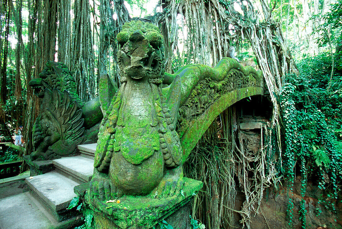 statue of a dragon in the monkey forrest, bridge, ubud, bali, indonesia