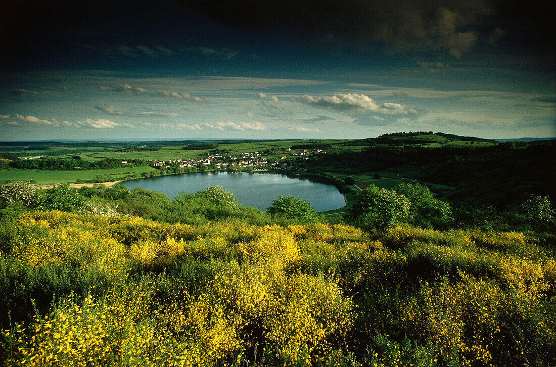 A landscape with a lake formed by a volcanic explosion, Schalkenmehrener Maar, Eifel, Rhineland-Palatinate, Germany