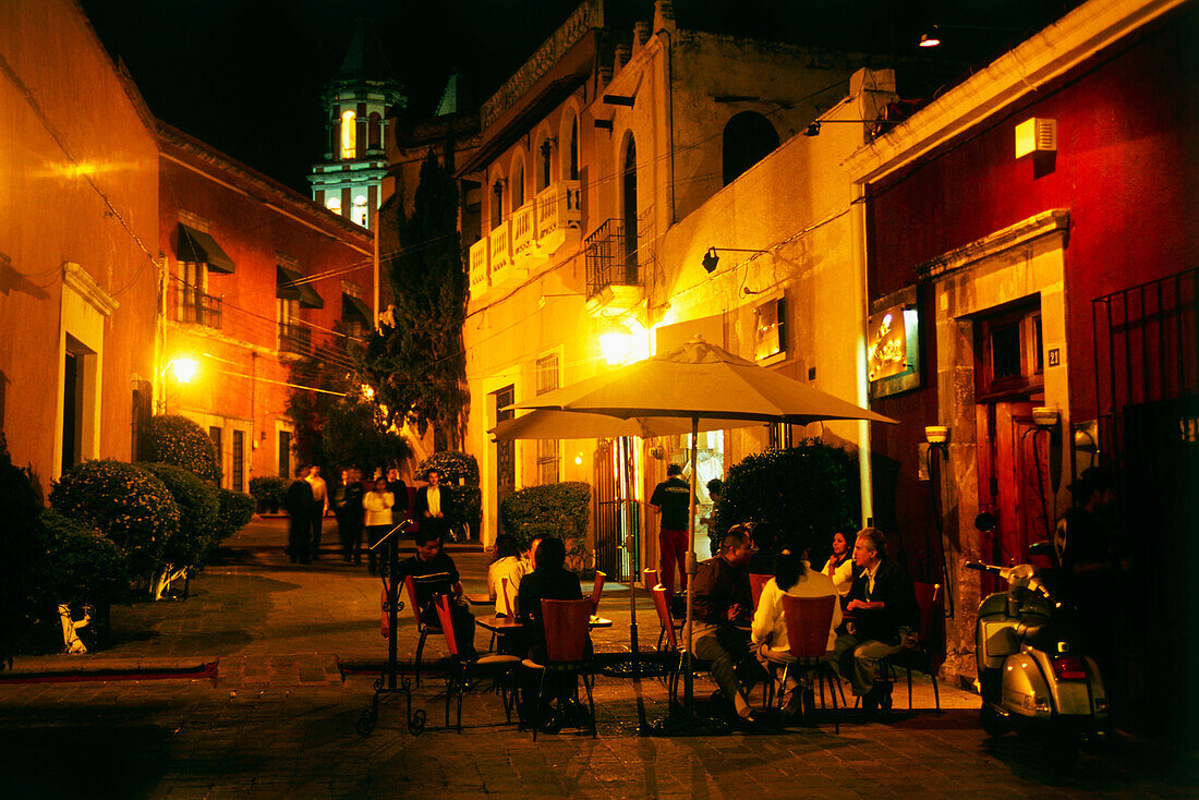 An alley in an old town and Temple in the background, Templo de la Congregation, Mexico