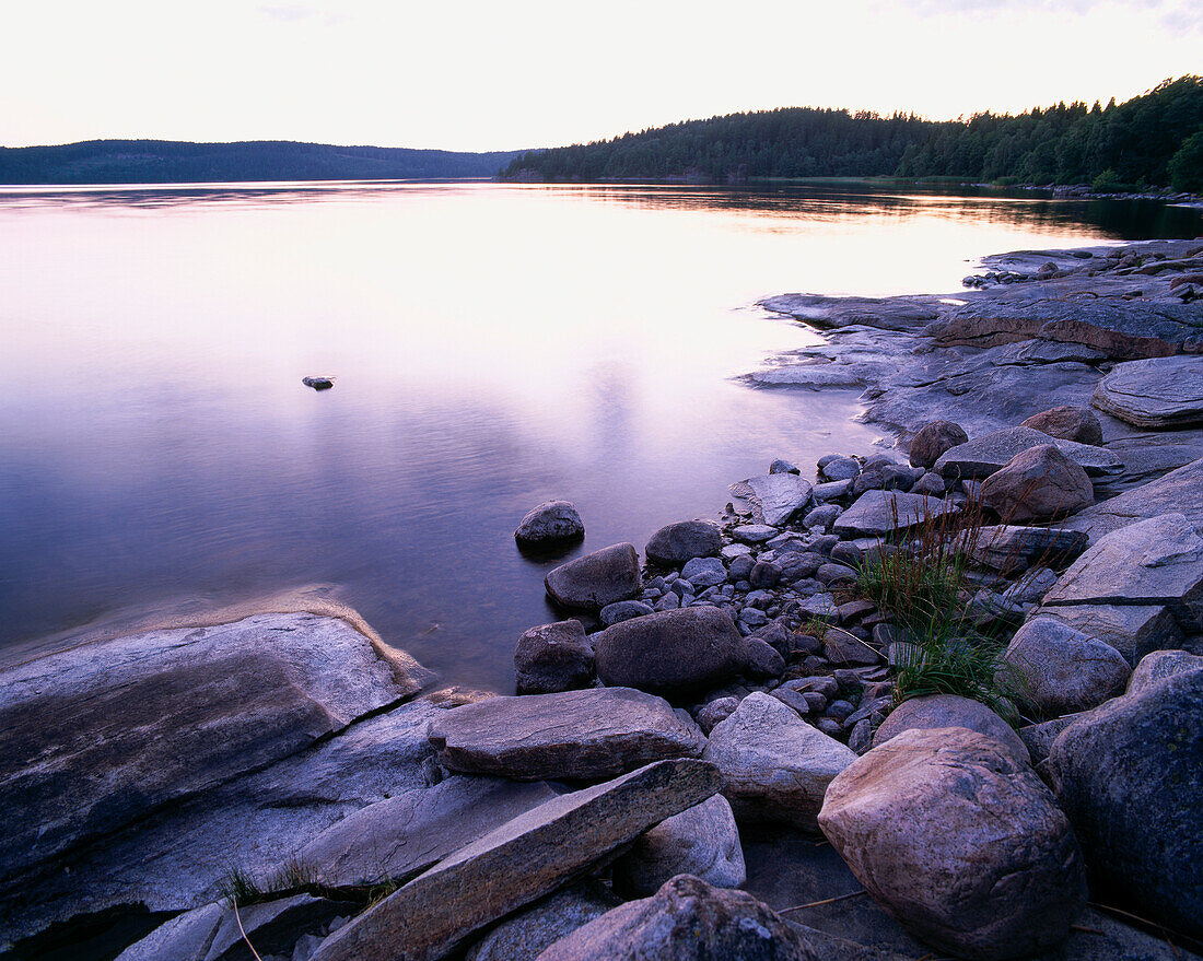 Reflection on water surface, bluff at lake, Sweden