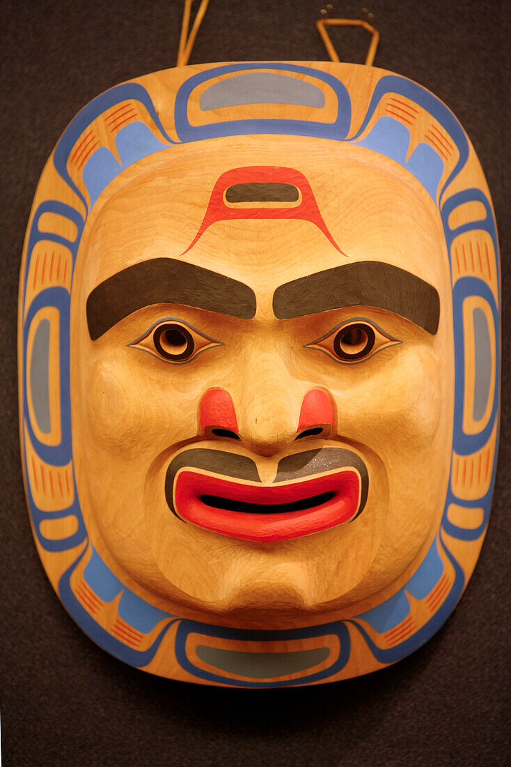 A carving of a face, mask inside the National Museum of the American Indian, Washington DC, United States USA