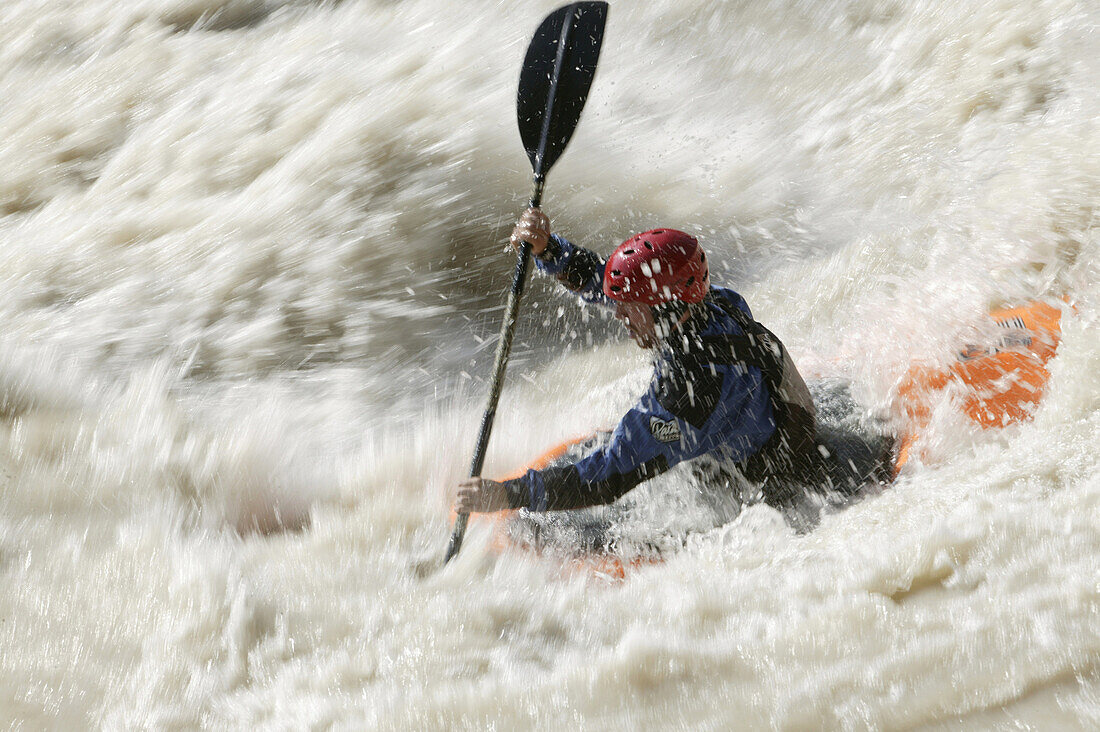 A man kayaking on the river Inn through the Imster Schlucht, Haiming, Tyrol, Austria