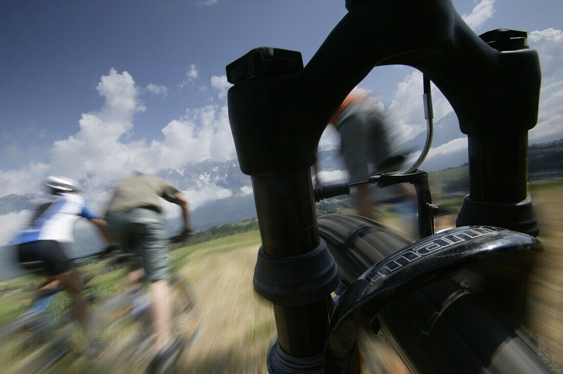 Cyclists riding mountain bicycles, Mieminger Plateau, Haiming, Tyrol, Austria