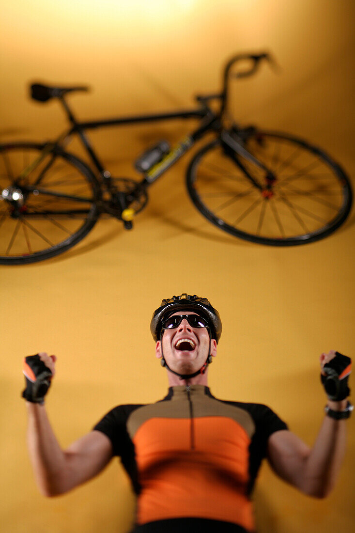 Male cyclist cheering