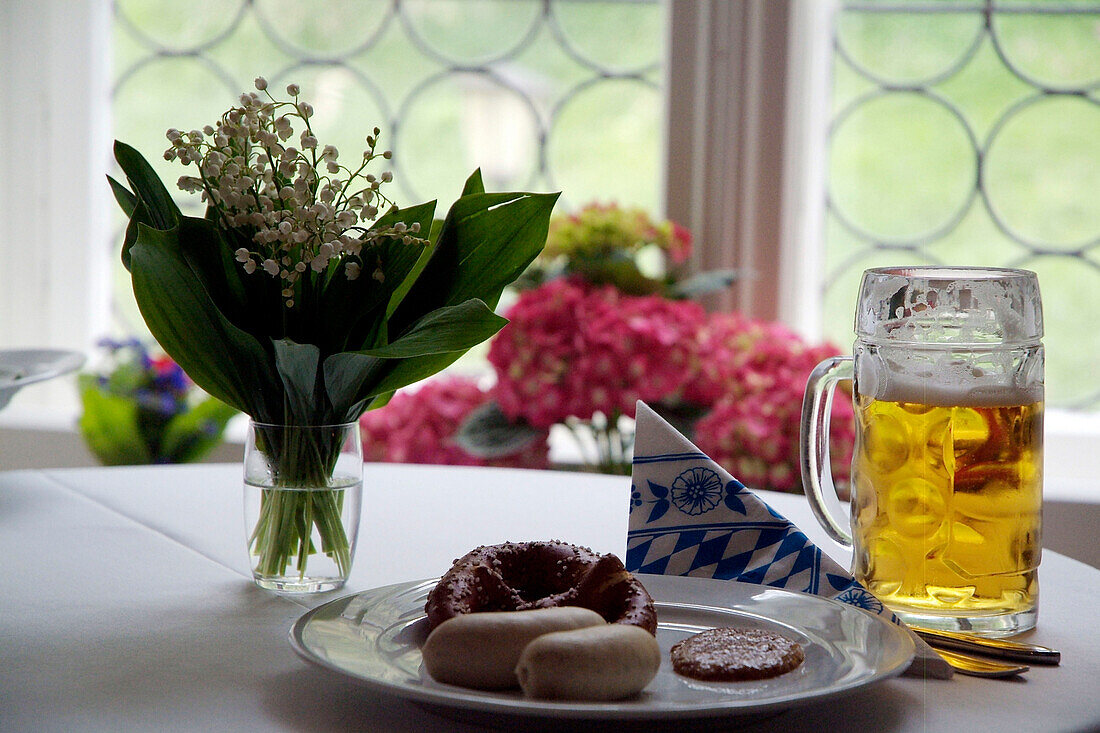 Weisswurst served with sweet mustard and accompanied be Brezen and Beer, White Sausage, Traditional Bavarian Sausage, Food, Bavaria, Germany, Prezel, Mass