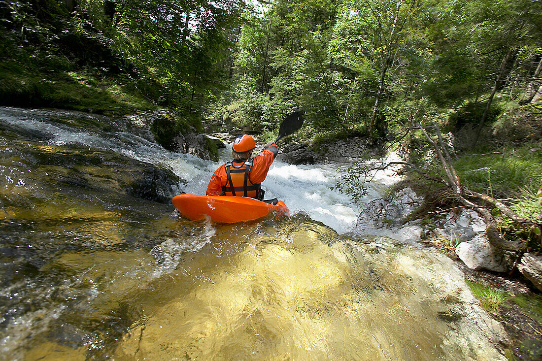 Man kayaking in rapid waters, River Gimbach, Salzkammergut, Upper Austria, Austria