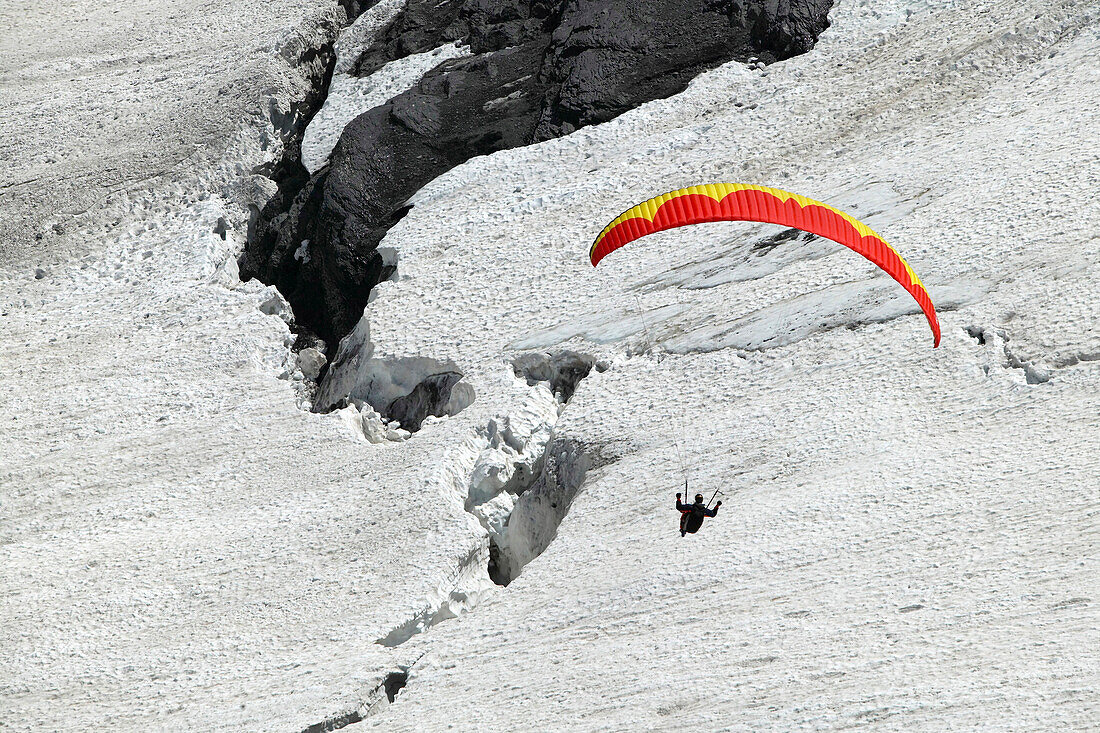 Paragliding above glacier, Jungfrauspitze, Interlaken, Berne Canton, Switzerland