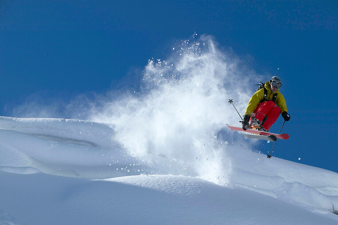 Skier jumping over cornice, Warth, Vorarlberg, Austria