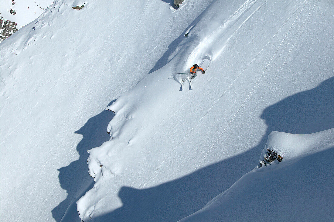 Skier on deep snow, Chandolin and Saint-Luc ski resort, Canton of Valais, Switzerland