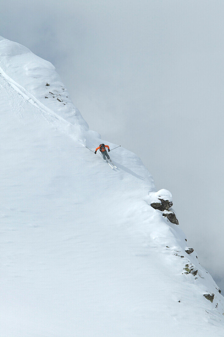 Skier on deep snow, Chandolin and Saint-Luc ski resort, Canton of Valais, Switzerland
