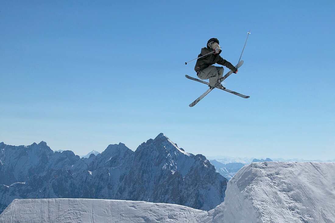 Skier jumping, Snowy Mountains, Zugspitze, Bavaria, Germany