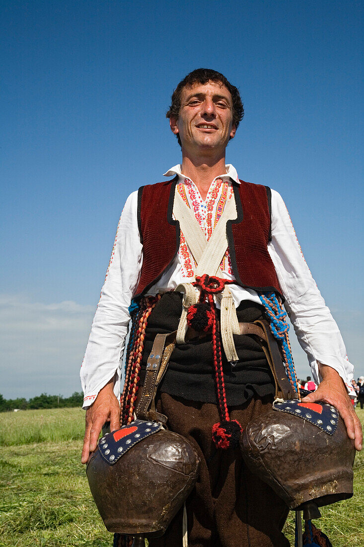 Man in traditional costume with bells, Rose Festival, Karlovo, Bulgaria, Europe