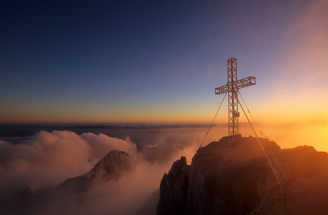 Cross on summit of Dachstein on a foggy morning, Salzburg, Upper Austria, Styria, Austria