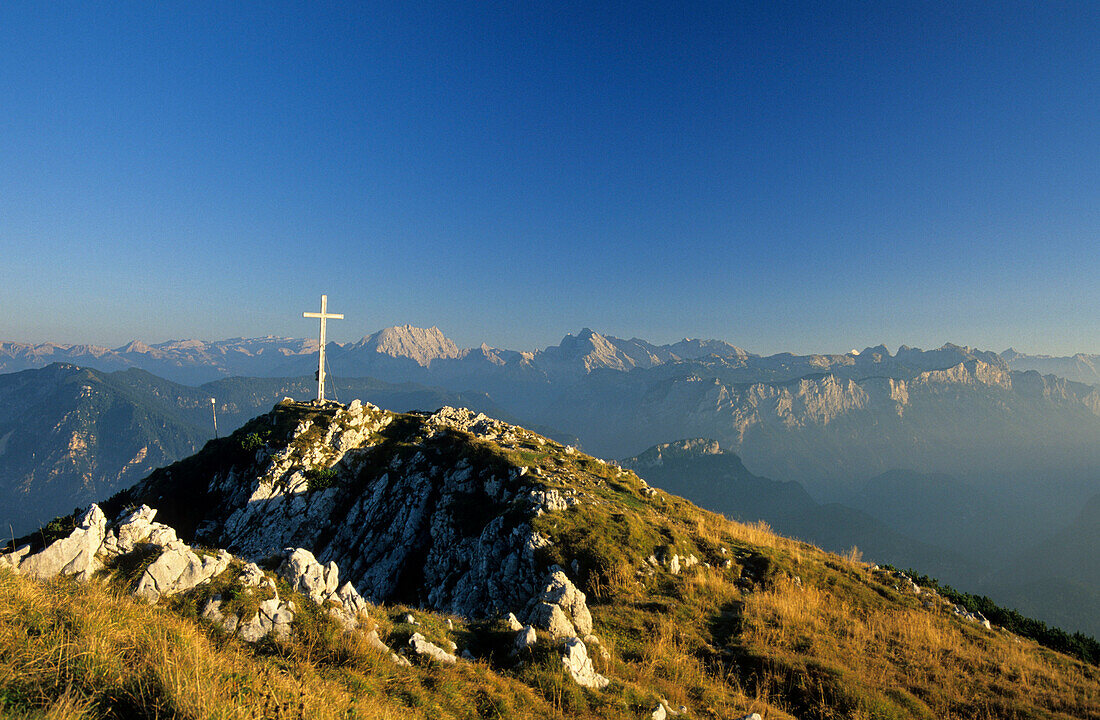 cross on summit of Zwiesel with view to Berchtesgaden range, Chiemgau, Upper Bavaria, Bavaria, Germany