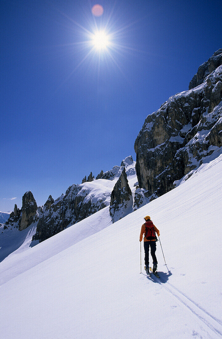 back-country skier at Passo Zigolade, Rosengarten range, Dolomites, South Tyrol, Italy