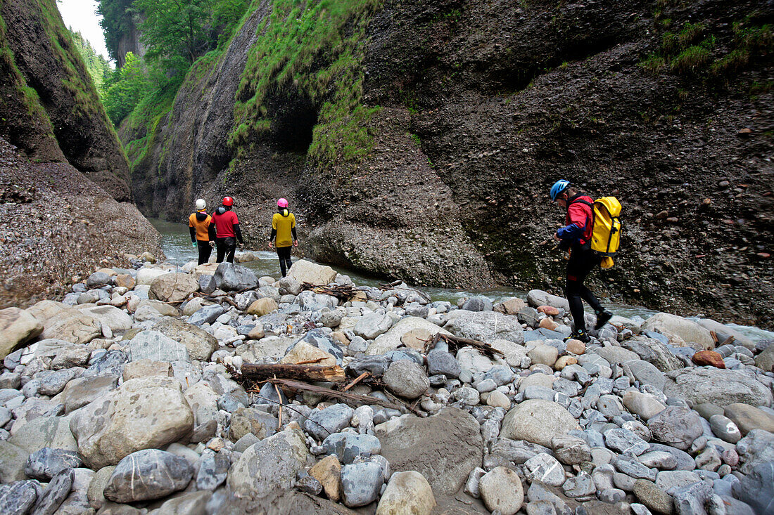 A group of people is doing a canyoning adventure in the Raebloch. The river Emme has erodet a 50 meter deep canyon into the rocks. It's a swim- and hiking canyon. Emmental, canton Bern, Switzerland, Europe, MR