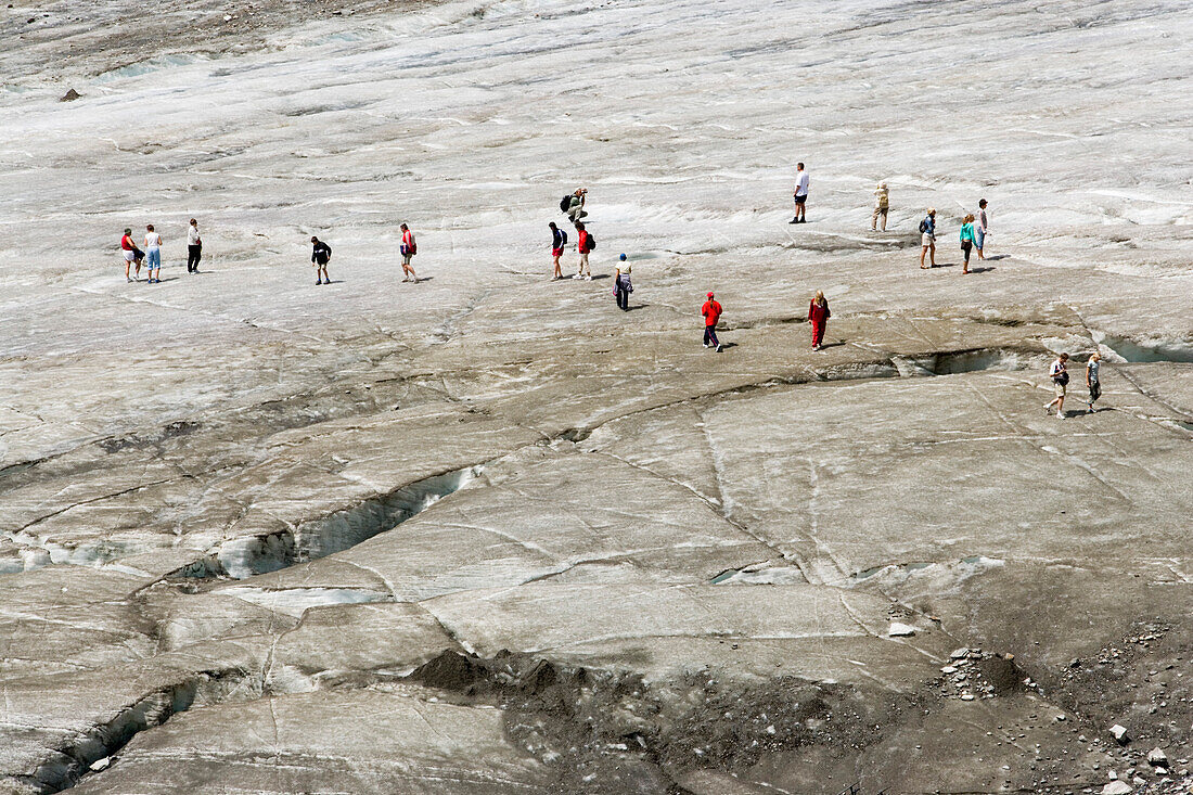 People walking on Pasterze glacier, the longest glacier in Austria, Franz Josephs Höhe, 2369 m, Grossglockner, 3798 m, the highest mountain in Austria, Carinthia, Austria