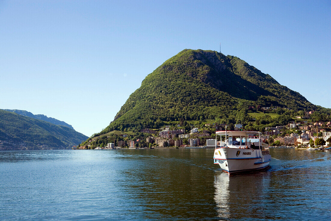 View over Lake Lugano to Monte San Salvatore (912 m), motorship passing, Lugano, Ticino, Switzerland