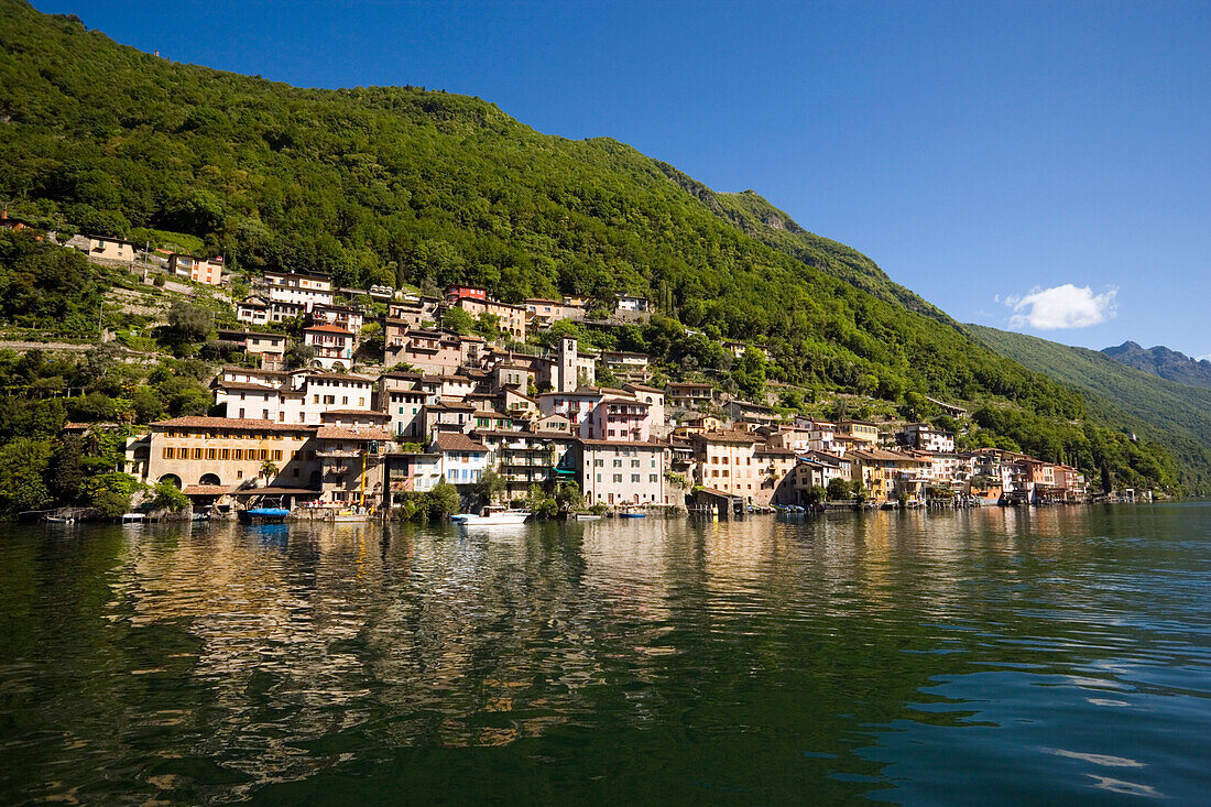 View over Lake Lugano to picturesque village Gandria at the foot of mountain, Monte Bre, Lugano, Ticino, Switzerland