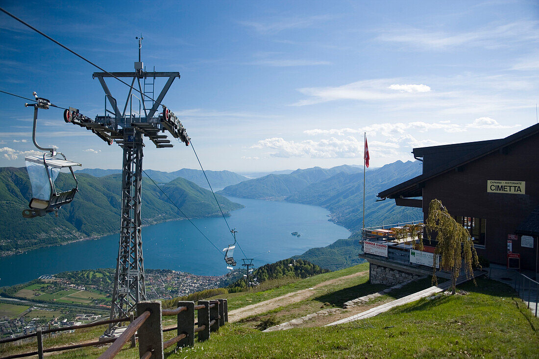 View from Monte Cimetta (1671 m) along chair lift to Locarno and Ascona at Lake Maggiore, Ticino, Switzerland