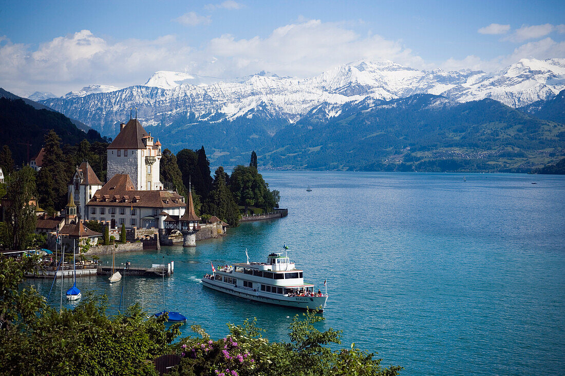 Excursion Boat at Castle Oberhofen at Lake Thun, Eiger 3970 m, Moench 4107 m and Jungfrau 4158 m in the background, Oberhofen, Bernese Oberland, Canton of Bern, Switzerland